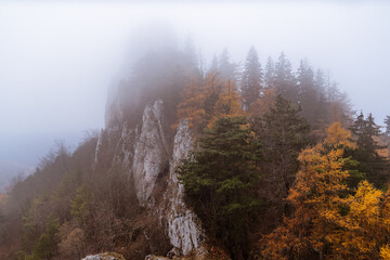 Autumn weather with low clouds in a rocky mountain environment
