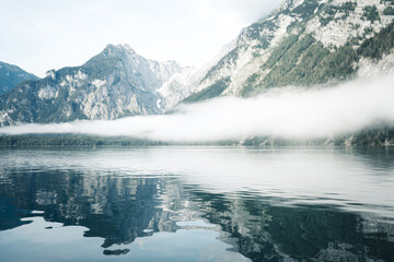 Reflecting Mountains and Fog in the Water of the Koenigssee (Königssee) in the Berchtesgadener Land, Bavaria, Germany