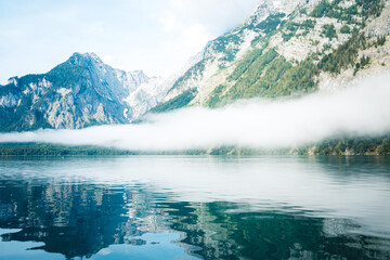 Reflecting Mountains and Fog in the Water of the Koenigssee (Königssee) in the Berchtesgadener Land, Bavaria, Germany