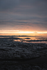 sunset over the sea in the swedish archipelago during winter