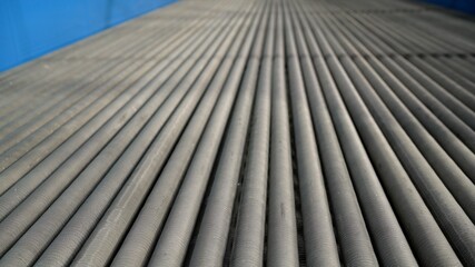 Close-up view of steel pipes at a metallurgical plant. Heat pipe production.
