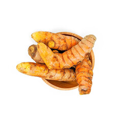 Fresh turmeric or curcuma in a wooden bowl isolated on a white background