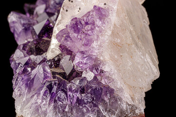 macro mineral amethyst stone with calcite black background