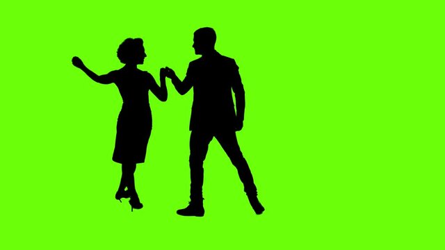 A Young couple dancing tango Part 1 profesional dancers on Green Screen Silhouette Pair in argentinian spanish dress performs dance movement 4K 60fps Argentina France Chroma key Argentina Buenos Aires