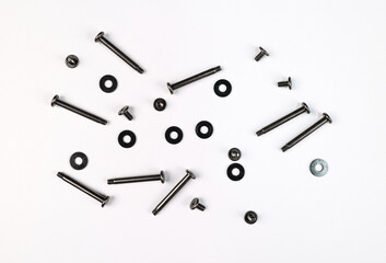 Macro shot of Long and small Screws with washer isolated on a White Background. These mounting...