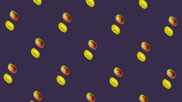 Colorful fruit pattern of fresh rotating mango on violet background. Seamless pattern with mango. Realistic animation. 4K video motion