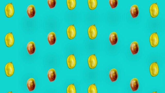 Colorful pattern of fresh mango. Top view. Seamless pattern with mango. Pop art design. Realistic animation. 4K video motion
