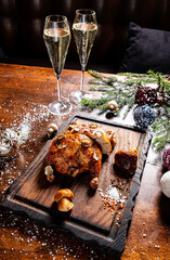 Christmas chicken and champagne on the table