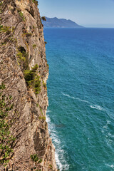 Fototapeta premium Sheer cliff by the sea, Greece.