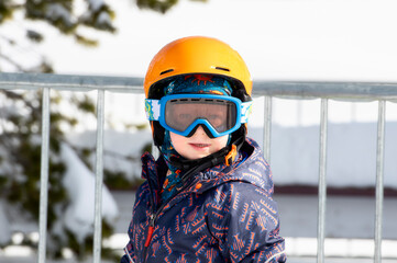 Toddler Boy Dressed Warmly & in Good Safety Gear Ready to go Ski