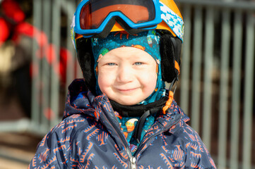 Toddler Boy Dressed Warmly & in Good Safety Gear Ready to go Ski