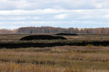 Fototapeta na wymiar territory for peat extraction in the autumn season