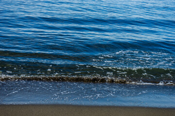 Black volcanic sand beach and sea
