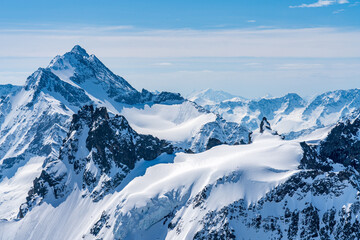 Fototapeta na wymiar Switzerland, Panoramic view on Snow Alps and Blue Sky around Titlis mountain