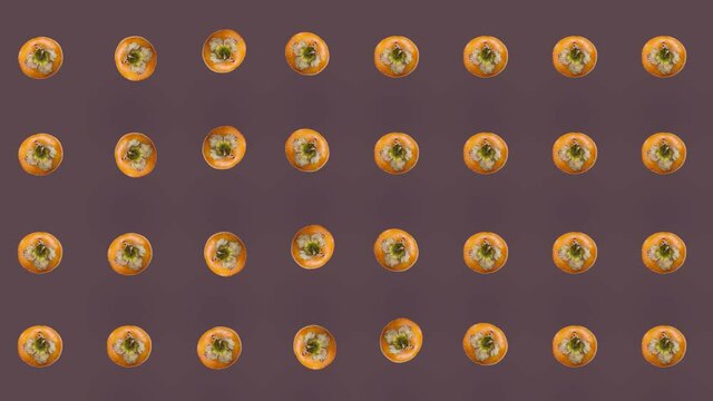 Colorful pattern of fresh orange persimmons. Top view. Seamless pattern with persimmon. Pop art design. Realistic animation. 4K video motion