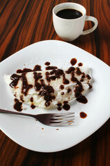 Sweet tapioca and coffee cup top view. Brazilian food made with cassava flour.