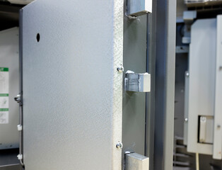 the extended crossbars of the open safe door.