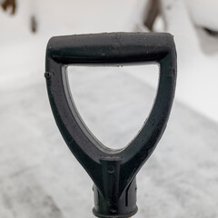 black snow shovel handle. close-up