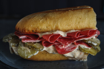 Sandwich with salami and pickled cucumbers