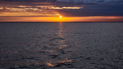 Russia. Onega lip of the White Sea. The sun goes down