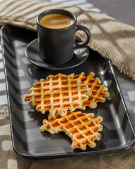 Homemade Belgium waffles served on a plate. Selective focus.