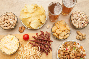 Nuts and snacks, a snack for beer on a light background.