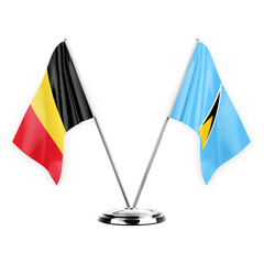 Two table flags isolated on white background 3d illustration, belgium and saint lucia