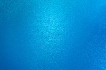 Fototapeta na wymiar Blue water in the pond texture drone view.