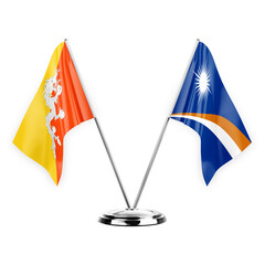 Two table flags isolated on white background 3d illustration, bhutan and marshall islands