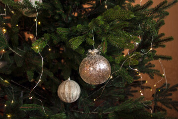 Christmas balls, garlands on the New Year tree. Winter holiday theme