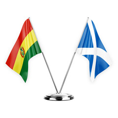 Two table flags isolated on white background 3d illustration, bolivia and scotland