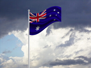 The flag of Australia on a stick, dark clouds in the background