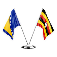 Two table flags isolated on white background 3d illustration, bosnia and uganda