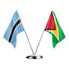 Two table flags isolated on white background 3d illustration, botswana and guyana