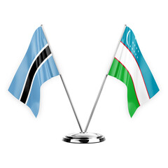 Two table flags isolated on white background 3d illustration, botswana and uzbekistan