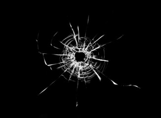 Bullet hole in the glass. Isolated on a black background. - obrazy, fototapety, plakaty