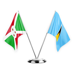 Two table flags isolated on white background 3d illustration, burundi and saint lucia