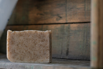 handmade rosemary soap on rustic wood