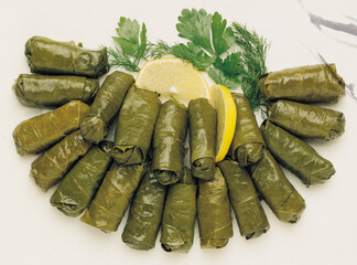 Sarma, stuffed grape leaves in a plate, traditional turkish cuisine. 