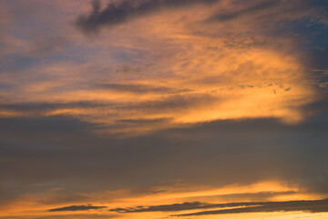 Clouds lit up in orange red color just after sunset