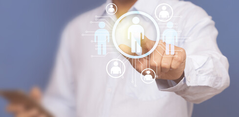 Close up of businessman hand pointing at business icons.Human Resources concept.