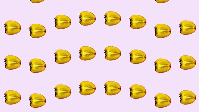 Colorful pattern of fresh orange persimmons on pink background. Seamless pattern with persimmon sliced. Realistic animation. 4K video motion