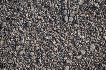 Background image of the surface of a gravel walking path