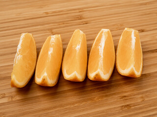 Fresh orange on a wooden background