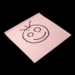 Paper sticker with the image of the happy smiley character on dark background.