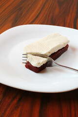 Brazilian dessert. Guava paste and white chesse with fork on the white plate.