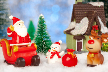 christmas greeting card, santa claus, snowman and reindeer with gifts on sleigh, concept