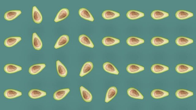 Colorful fruit pattern of fresh avocados on green background. Seamless pattern with avocado. Realistic animation. 4K video motion