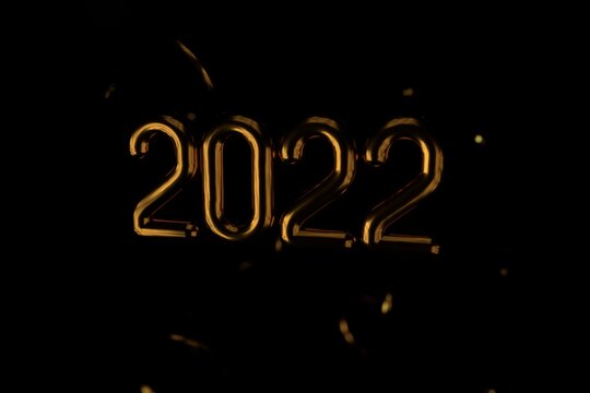 Happy New 2022 Year. Holiday vector illustration of golden metallic numbers 2022 and sparkling glitters pattern. Realistic 3d sign. Festive poster or banner design