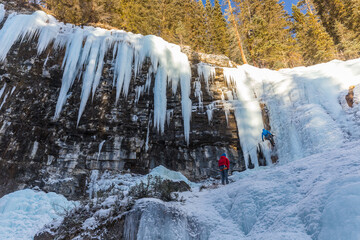 Ice climbers on frozen waterfall in Johnston Canyon